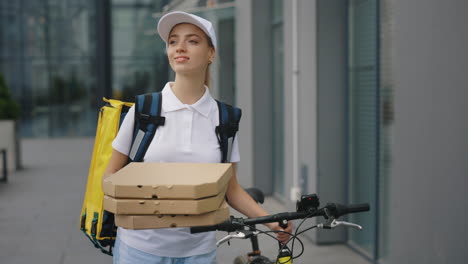 woman delivering pizza on bike