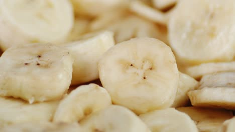 round slices of fresh banana slowly rotate.