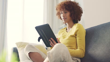 one young female freelancer smiling while browsing