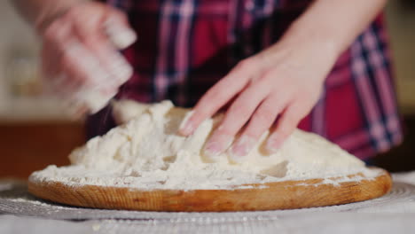 the baker's hands knead the pizza dough video with shallow depth of field 4k video