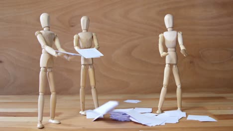 business figurine standing near pile of documents falling from top