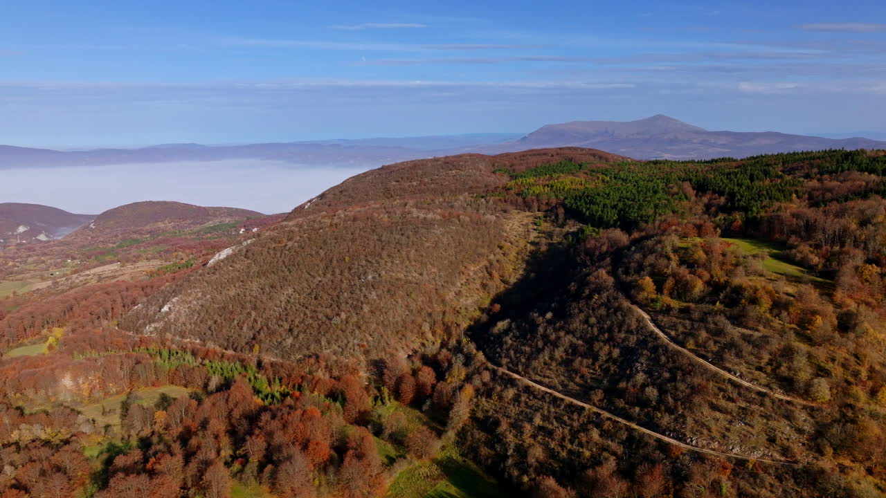 Aerial View of Autumn Mountains and Foggy Valley