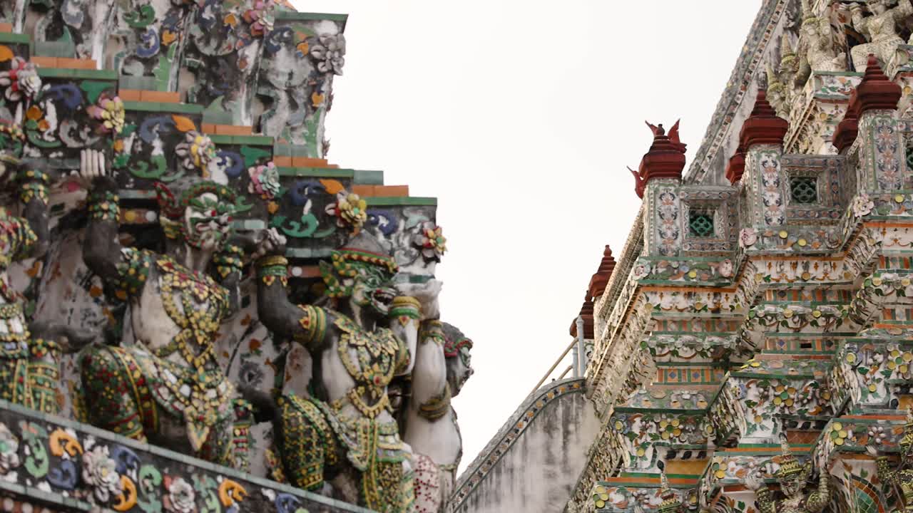 Close-up views of Wat Arun's ornate architecture in natural light, highlighting intricate carvings and colorful mosaics