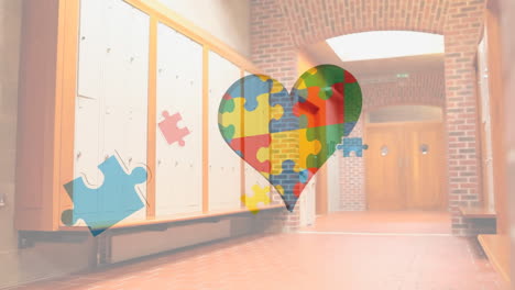 animation of puzzles falling over heart formed with puzzles and empty school corridor