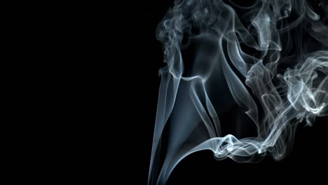 smoke on black background jet rises up. smoke dissipates.