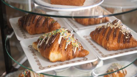 close up of delicious chocolate and sprinkled croissants