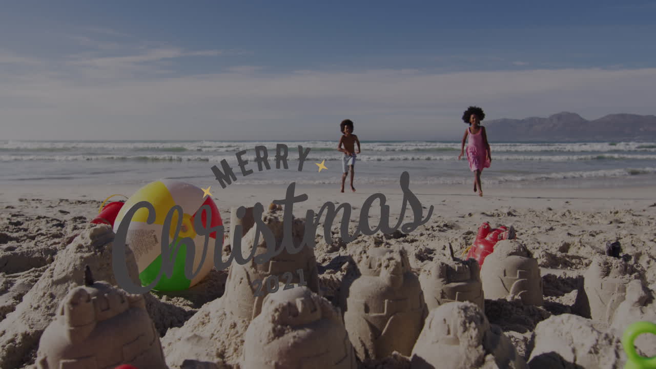 animación de felicitaciones de navidad texto sobre niños afroamericanos en la playa