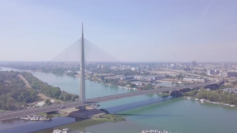 Slow-beautiful-panorama-shot-of-Ada-bridge-in-Belgrade-and-New-Belgrade-on-Sava-river