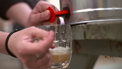 beer being poured from keg slow motion