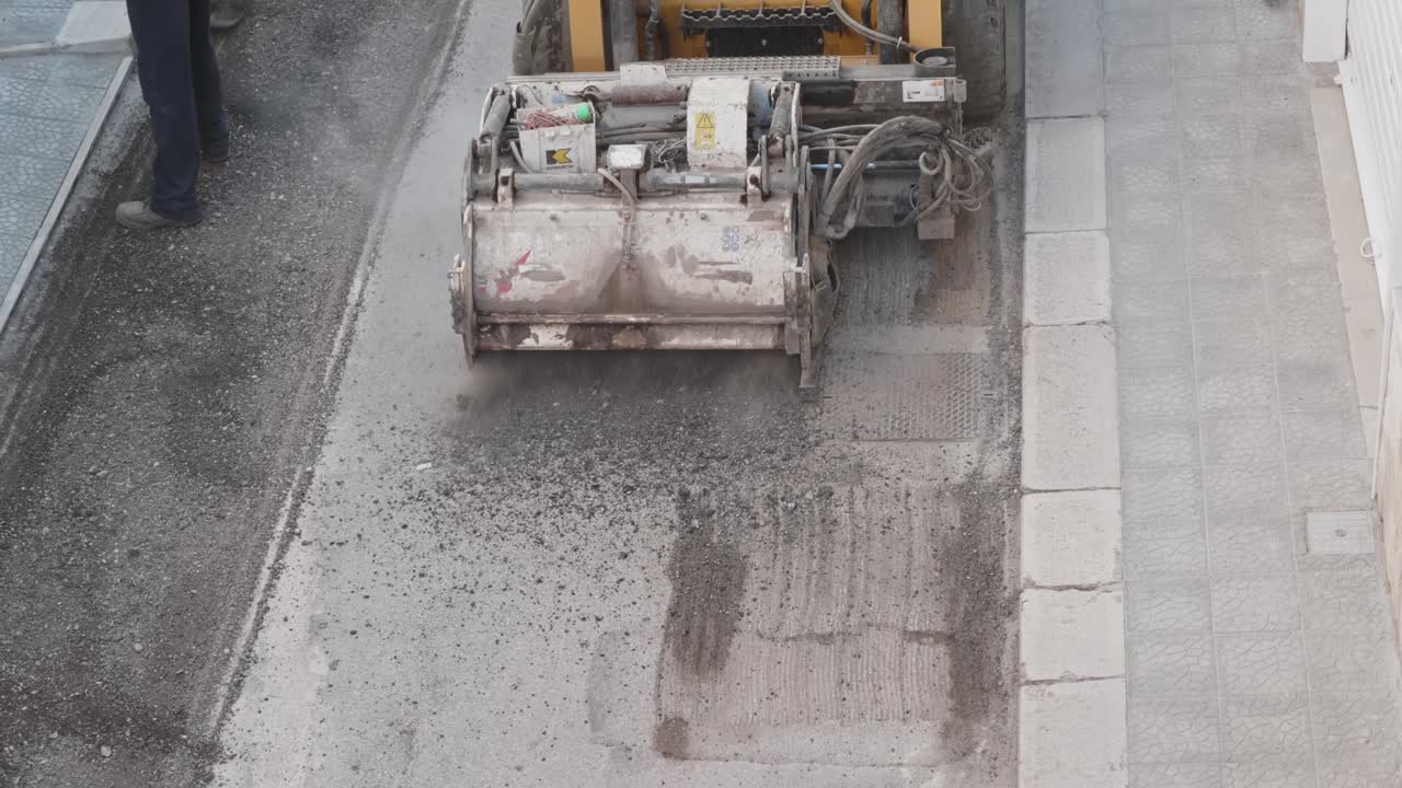 Milling of asphalt for road reconstruction accessory for skid steer