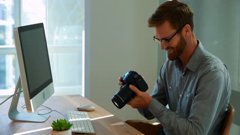 Male-executive-working-over-computer-at-his-desk