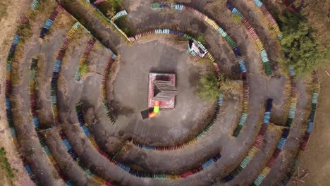 aerial top down view of an abandoned outdoor circular labyrinth in the park