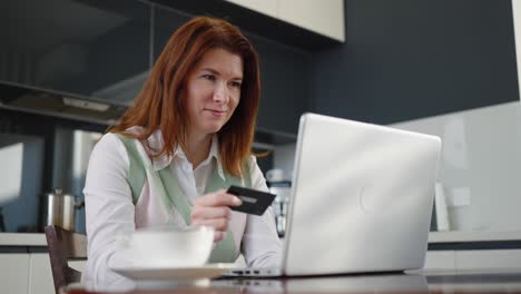 adult woman using credit card for shopping online