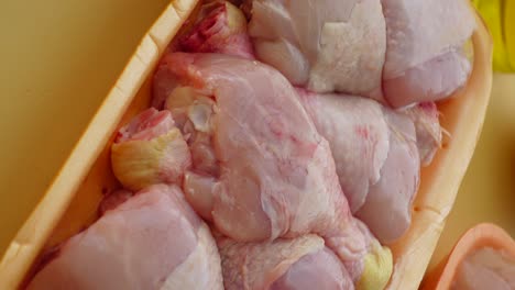 raw chicken legs in tray