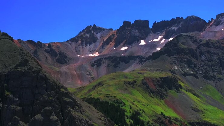 Mount Sneffels Wilderness Ridgway Telluride Colorado sunny morning summer Blue Lakes trail hiking trail aerial drone San Juan Rocky Mountains Uncompahgre National Forest blue sky parallax circle left