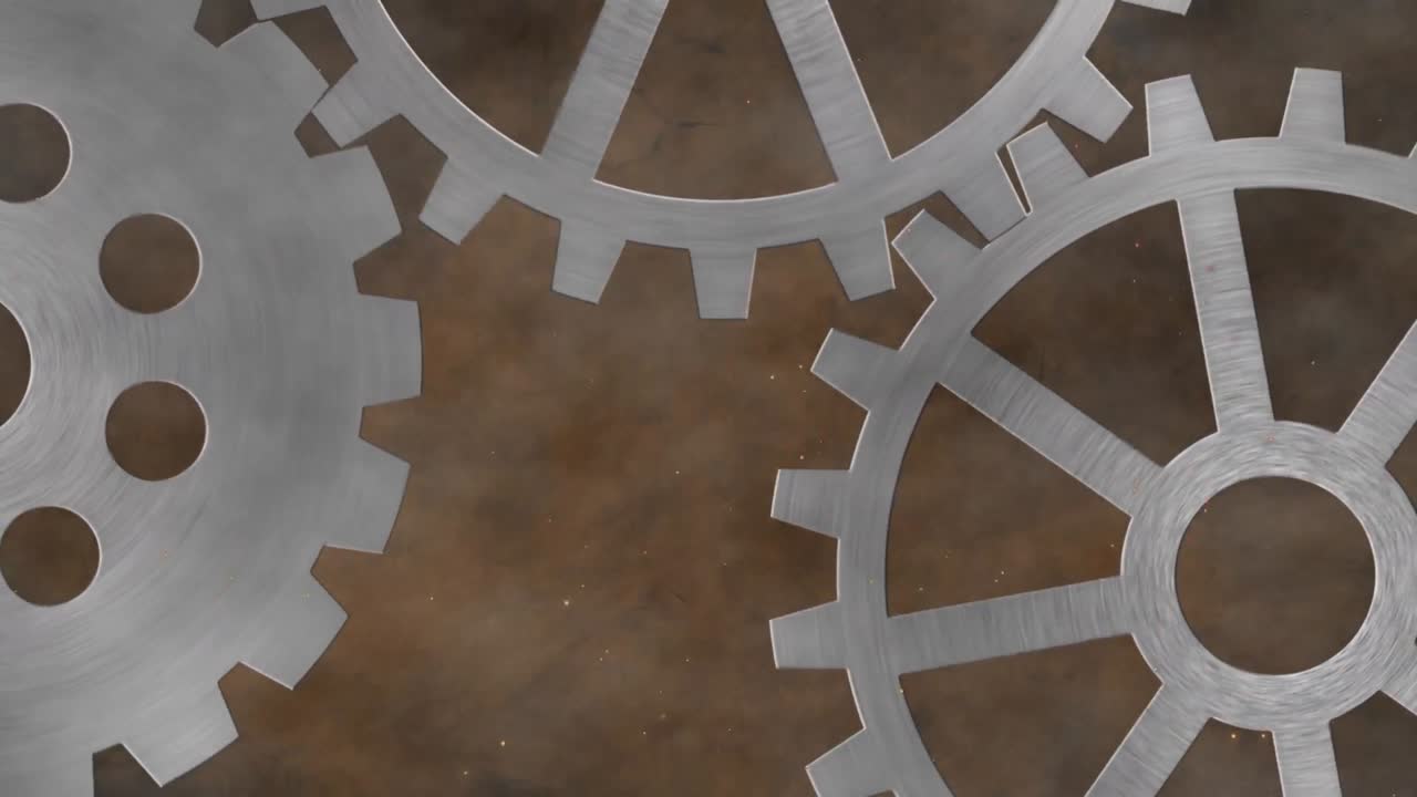 Animation of three grey metallic silver spinning cogs