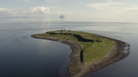 Aerial-view-of-Pladda-Lighthouse-on-the-Isle-of-Arran-on-a-sunny-day,-Scotland