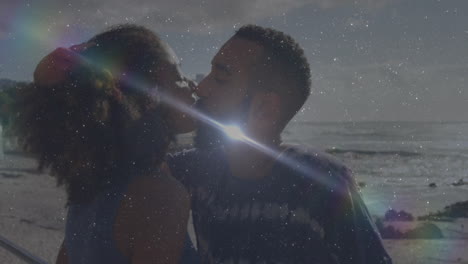 kissing on beach, couple surrounded by sparkling light effects like animation