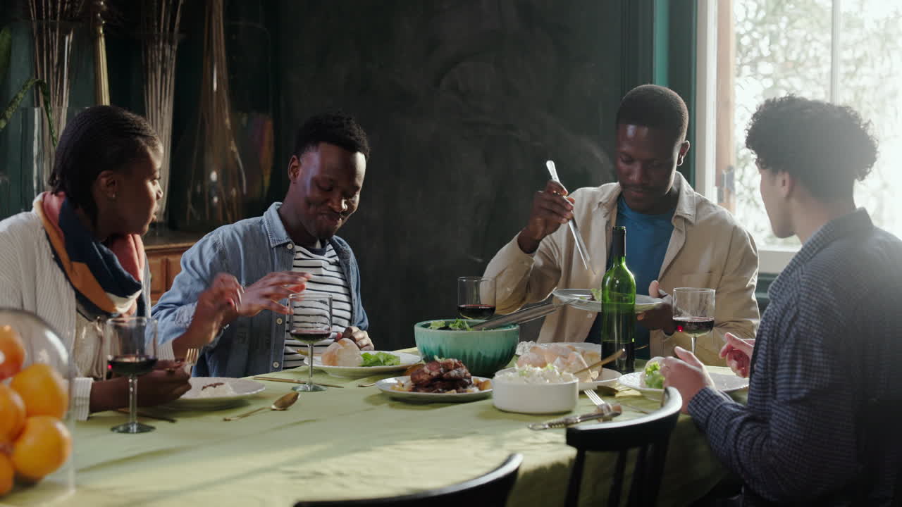 People having dinner together at a dining table