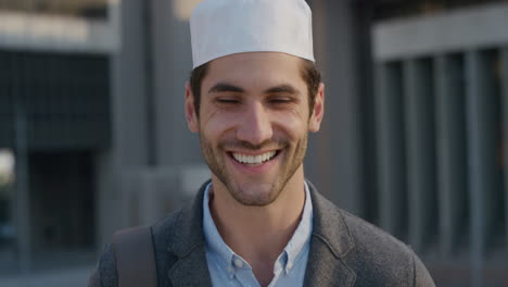 portrait attractive young arab businessman smiling confident entrepreneur enjoying professional urban lifestyle in city at sunset slow motion