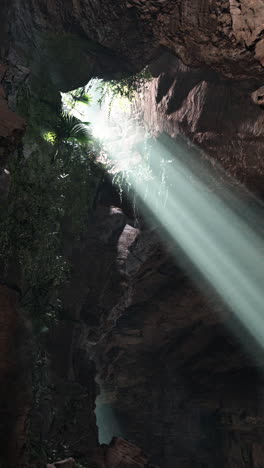 sunlight beams through cave entrance