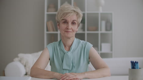 portrait-of-charming-aged-woman-looking-at-camera-and-nodding-head-video-call-and-online-chat-concept