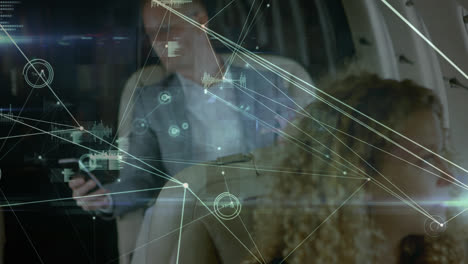 Animation of network of connections over caucasian business people in plane using smartphone