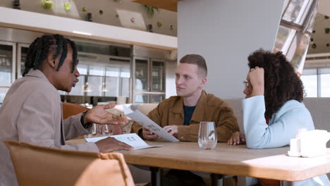 Friends having lunch/dinner in a modern restaurant