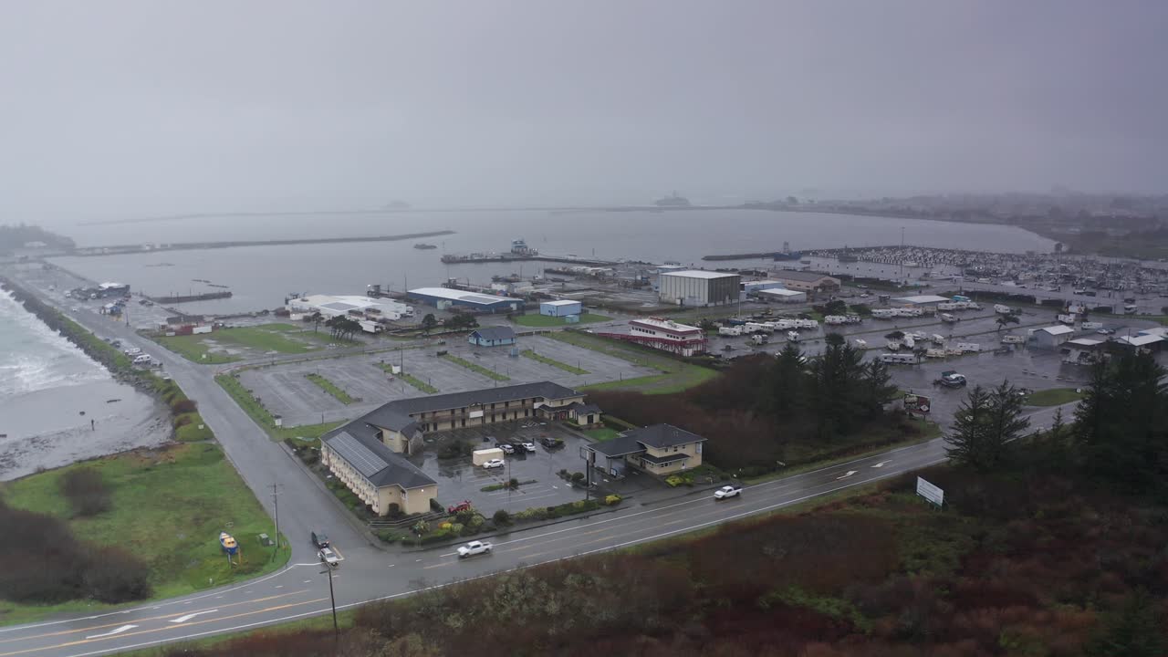Wide aerial panning shot of a motel during a storm in Crescent City, California. 4K