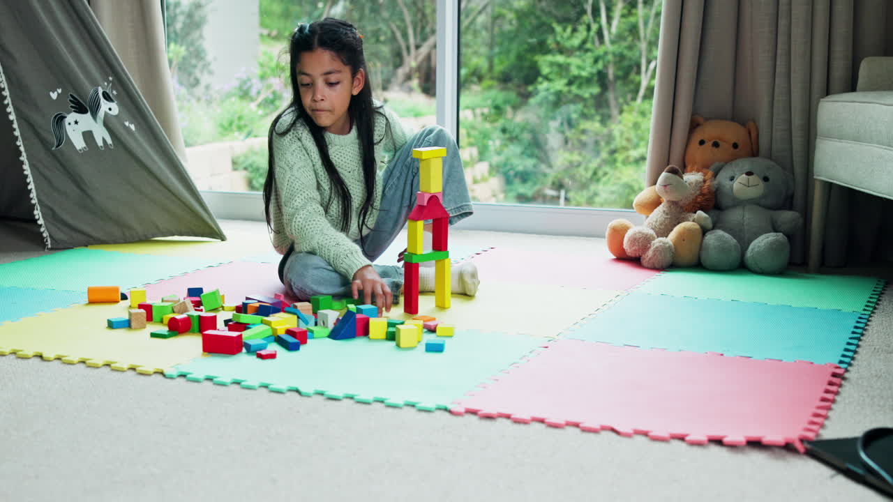 A child playing with building blocks in a playroom