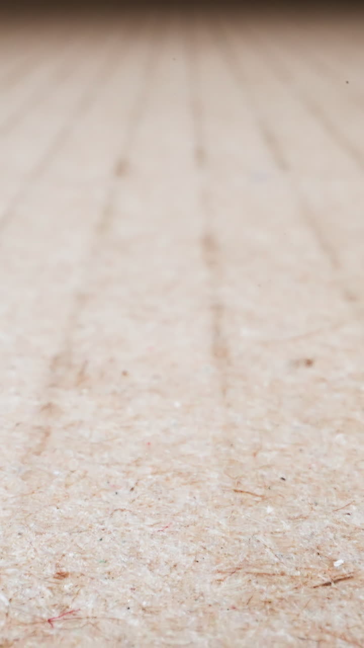 Texture surface of empty cardboard paper at bright light macro view. Natural material for packaging. Eco friendly recyclable supplies demonstration