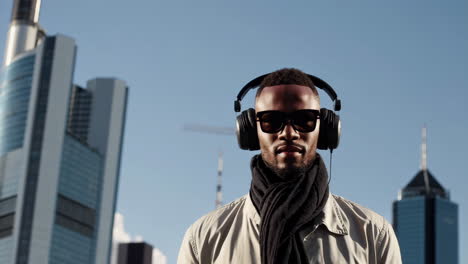man with headphones in city