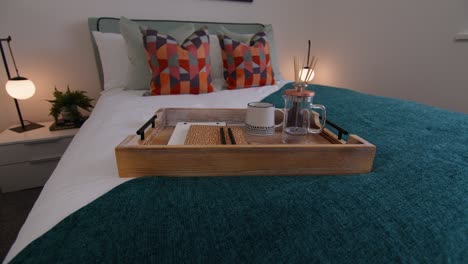 breakfast tray on a double bed in a show home