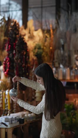 young woman shopping for christmas decorations