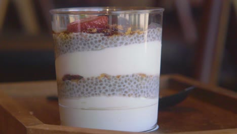 chia pudding with yogurt, granola, and fruit