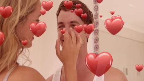 animación de corazones rojos sobre una pareja enamorada sonriendo