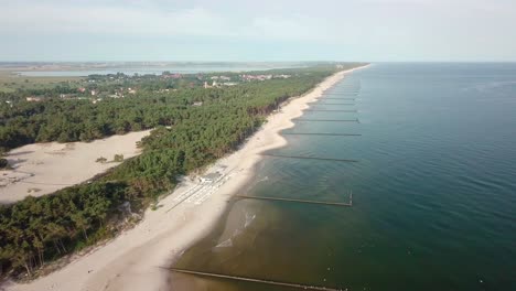 aerial footage of a fine summer day on the polish seaside. baltic seashore free of tourists, early in the morning.