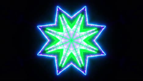 green and blue flower with black background and blue center. kaleidoscope vj loop