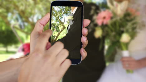 hand showing wedding clips on smartphone