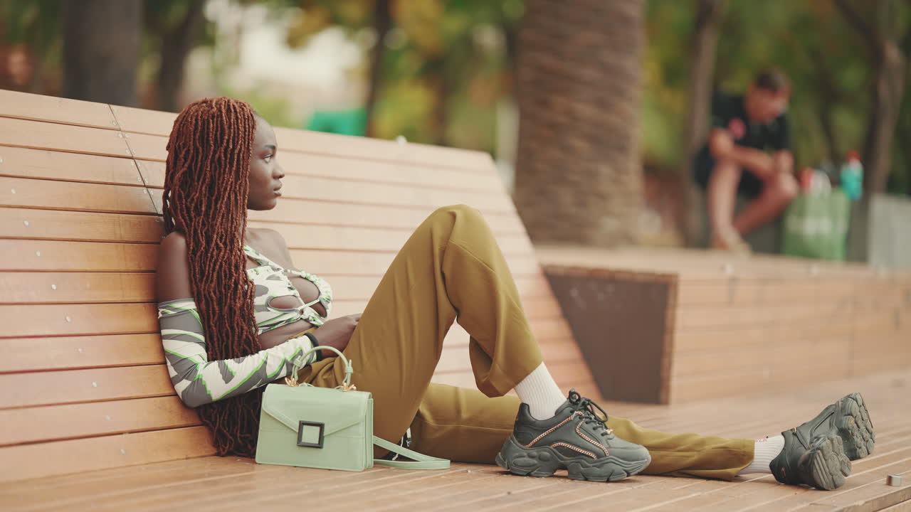 Woman Relaxing on a Bench in the Park