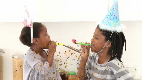 blowing party horns with confetti animation, children celebrating at party