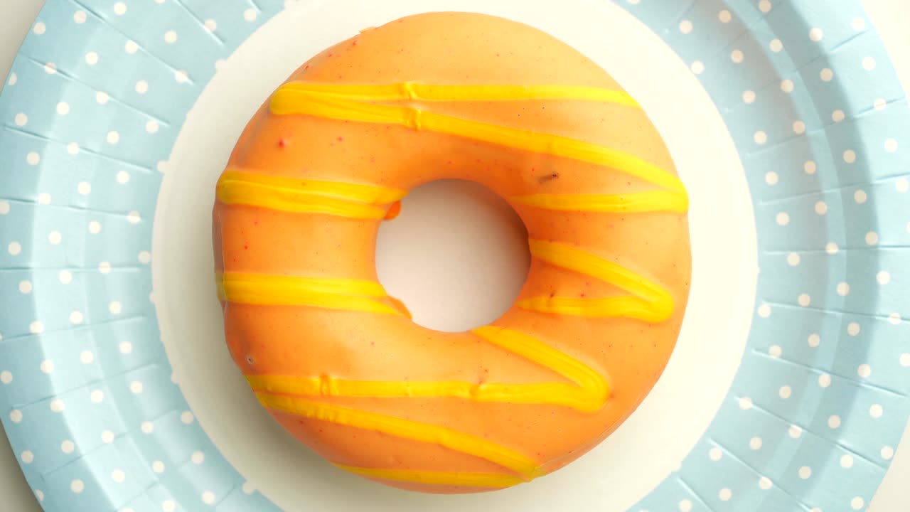 Doughnut glazed close-up. Seamless looping.