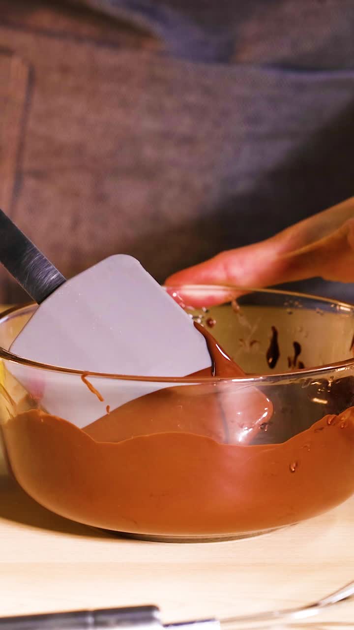 Mixing chocolate with fruits and sprinkles