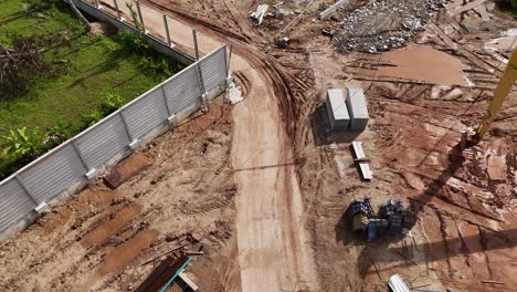 construction site with excavator and materials