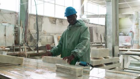 man polishing marble