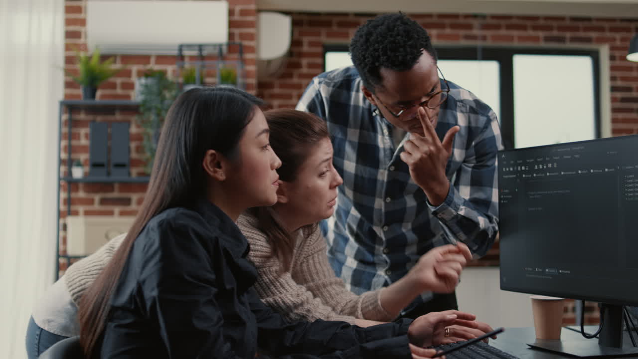 Mixed team of software engineers brainstorming ideas for new cloud computing user interface