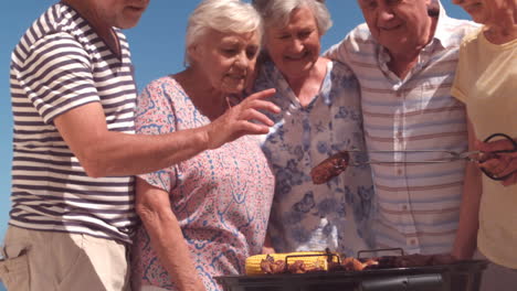 group of mature people preparing a barbecue