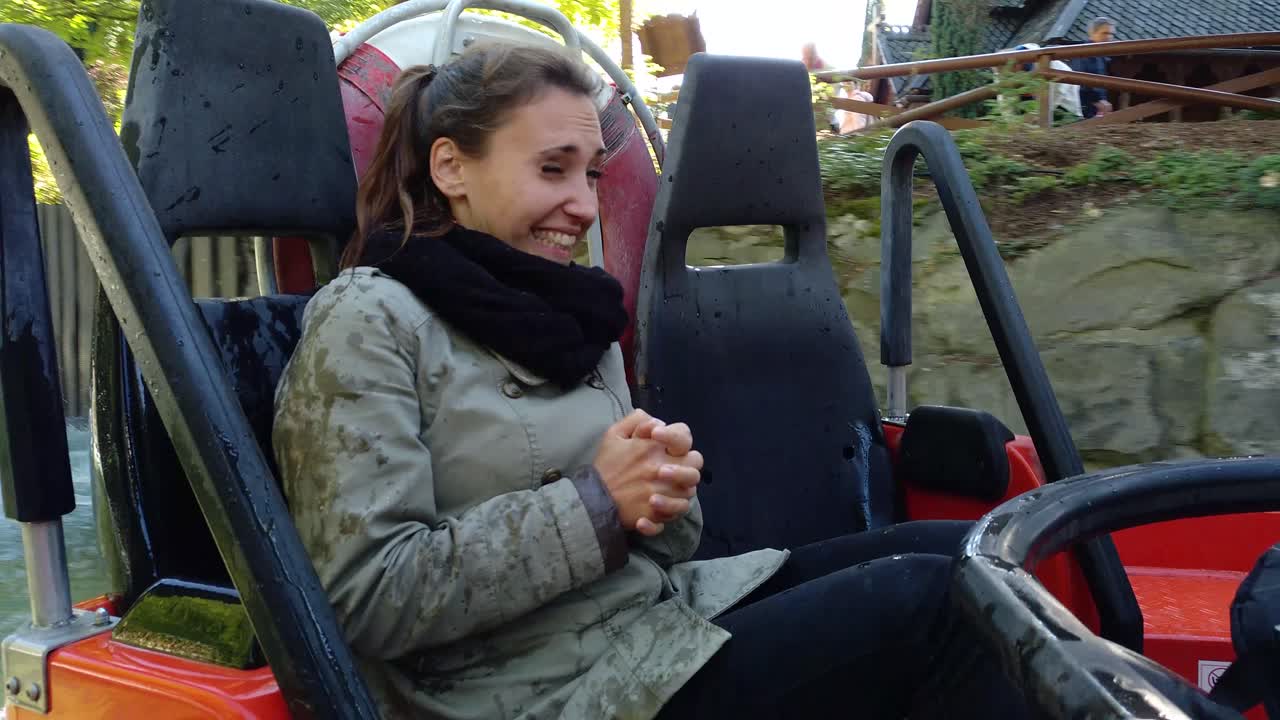 a beautiful Girl in a wild water rafting course in a theme park