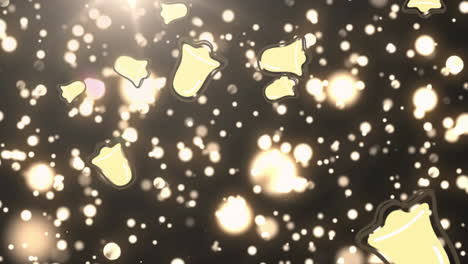múltiples iconos de campanas de navidad cayendo contra manchas doradas de luz sobre un fondo negro