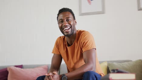 portrait of happy african american man looking at camera and smiling